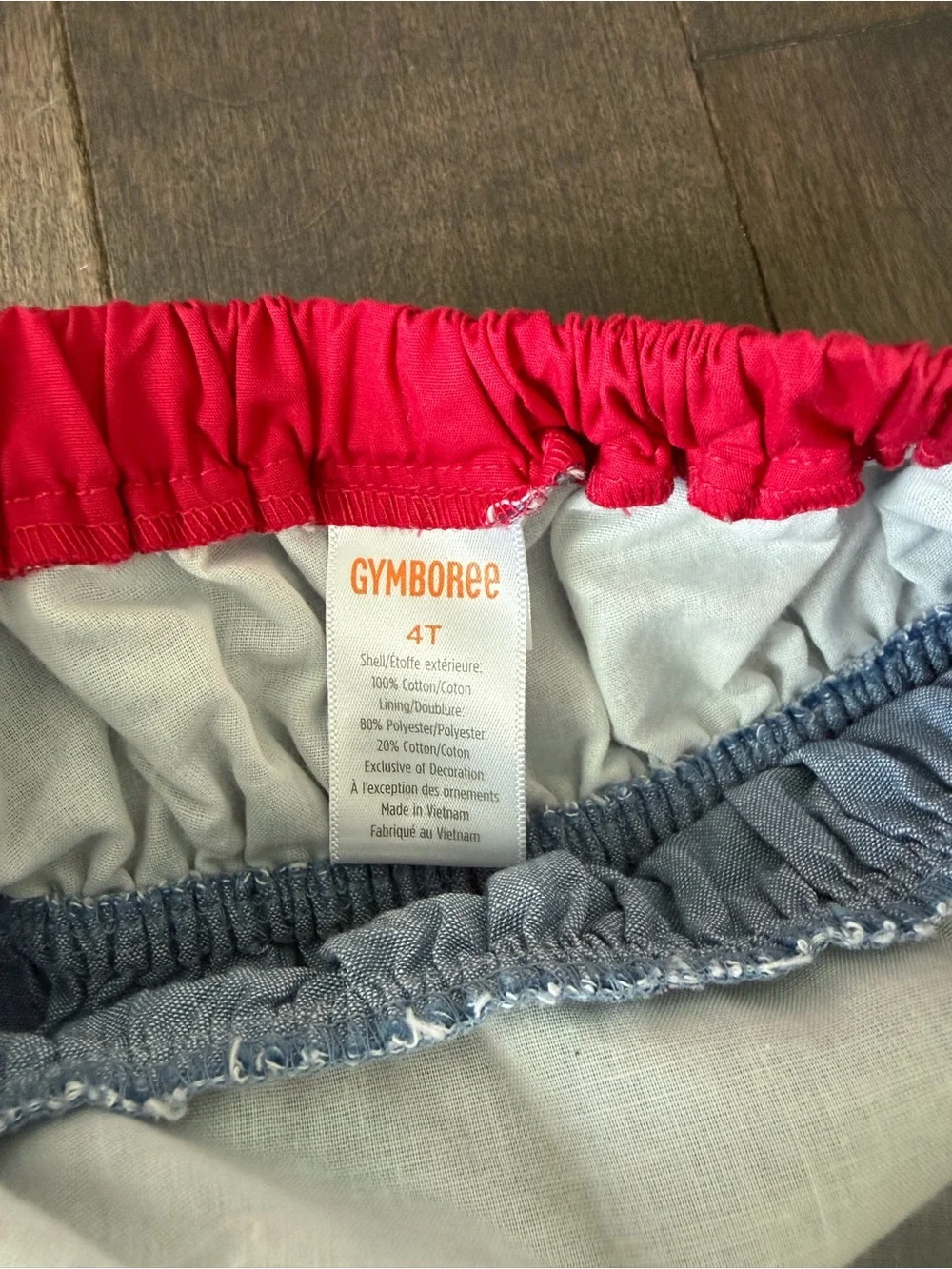 Gymboree Toddler Girl Denim Halter Dress with red trim and cherry pockets .